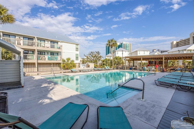 community pool with a patio area