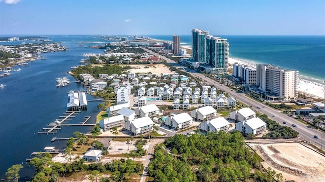 birds eye view of property featuring a view of city and a water view