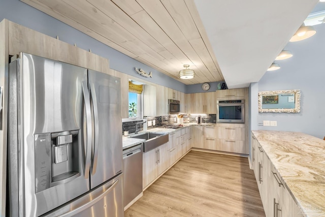 1112 Maldonado Dr, Pensacola Beach, FL 32561 - kitchen featuring light brown cabinets, wooden ceiling, backsplash, sink, and stainless steel appliances