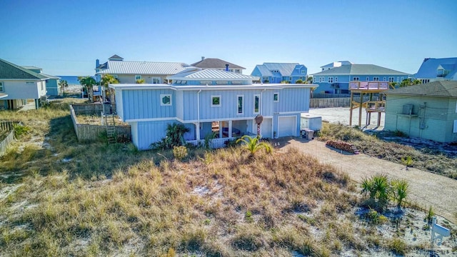1112 Maldonado Dr, Pensacola Beach, FL 32561 - rear view of property with a garage