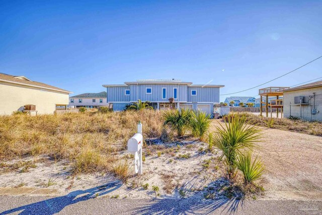 1112 Maldonado Dr, Pensacola Beach, FL 32561 - rear view of house featuring a garage