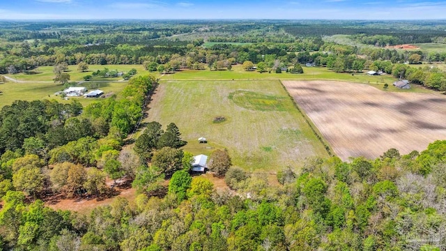 drone / aerial view with a rural view and a view of trees