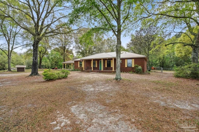 view of front facade with fence and a porch