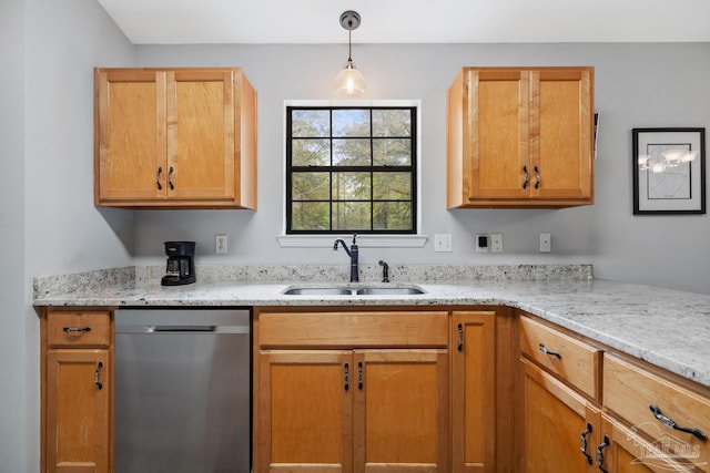 kitchen with dishwasher, a sink, decorative light fixtures, and light stone counters