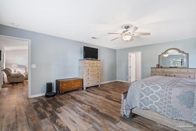 bedroom with baseboards, ceiling fan, and wood finished floors