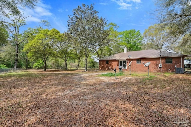 view of yard with fence and cooling unit