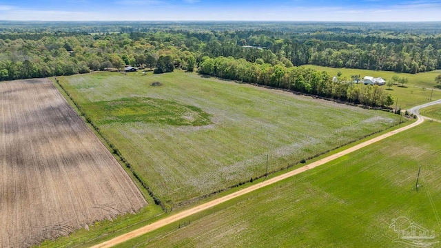 aerial view with a wooded view and a rural view