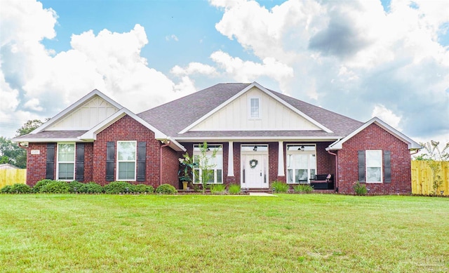 ranch-style home featuring a front lawn