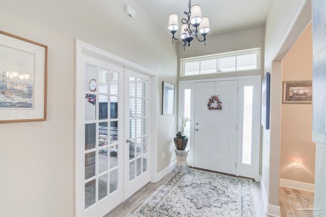 view of exterior entry with covered porch