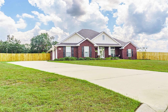 view of front of home with covered porch and a front lawn