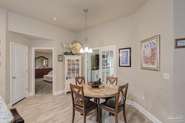 living room featuring ceiling fan, light colored carpet, and a raised ceiling