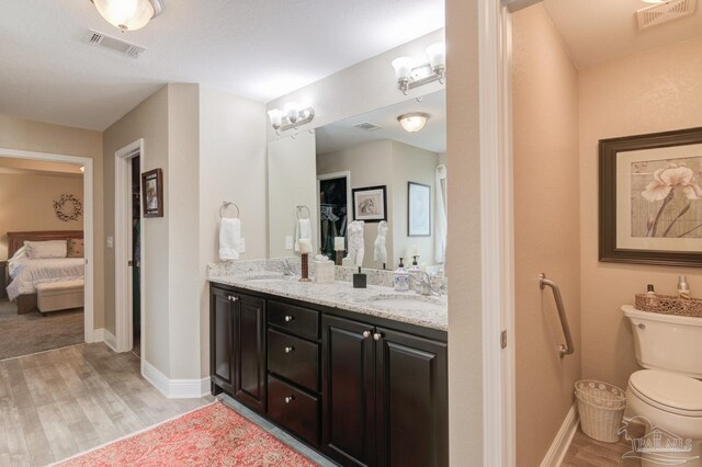 bathroom featuring independent shower and bath and hardwood / wood-style flooring