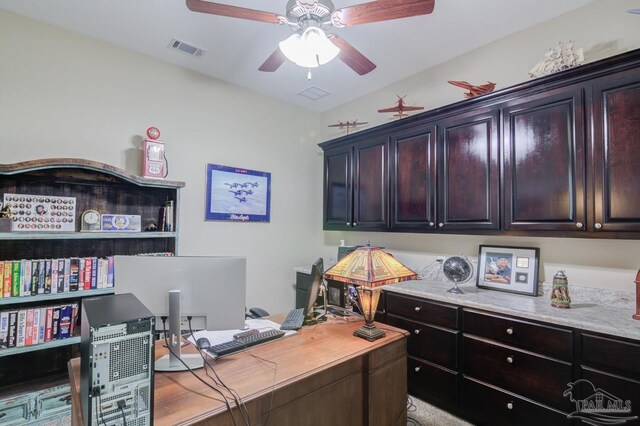 carpeted office space with french doors and ceiling fan