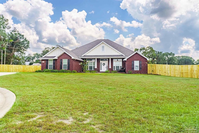 view of front of house with a garage and a front yard