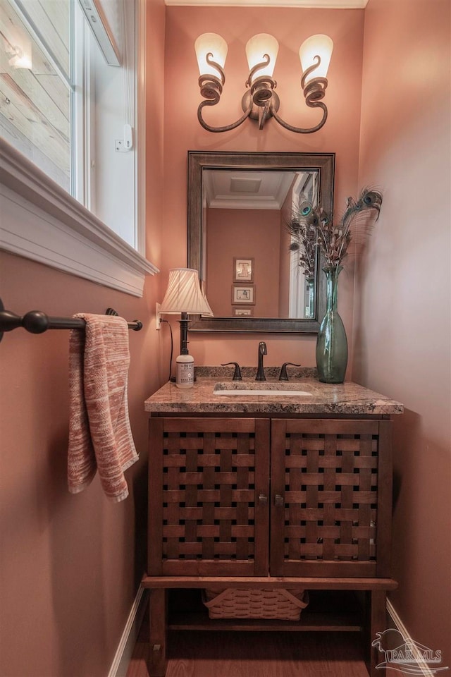 bathroom featuring vanity and crown molding