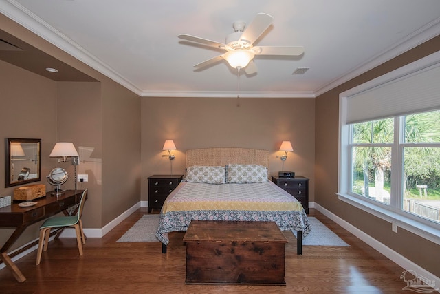 bedroom featuring dark hardwood / wood-style flooring, crown molding, and ceiling fan