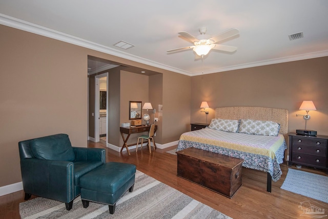 bedroom with ornamental molding, hardwood / wood-style floors, and ceiling fan