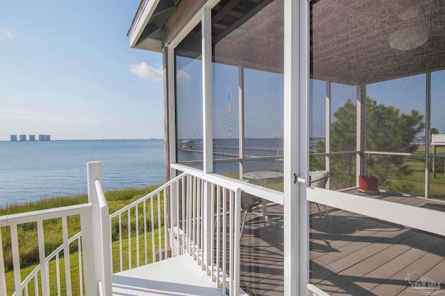 wooden deck with a water view