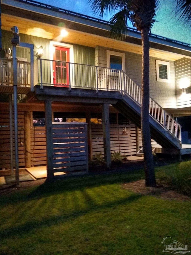 rear view of house with a yard