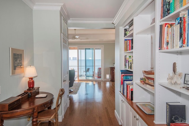 hall with a water view, ornamental molding, and dark hardwood / wood-style floors