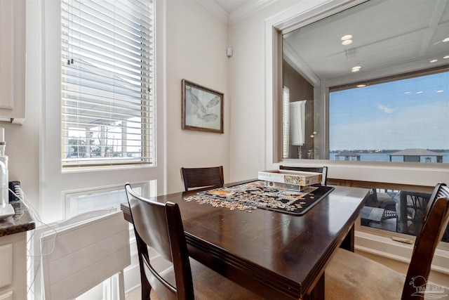 dining area featuring crown molding