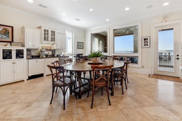 tiled dining area with ornamental molding