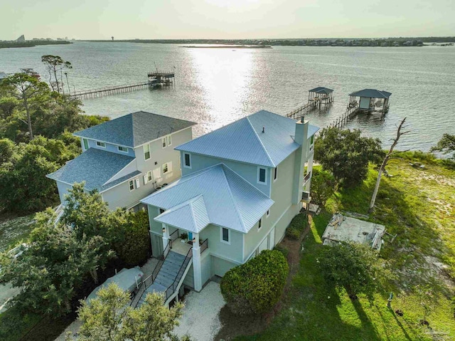 birds eye view of property with a water view