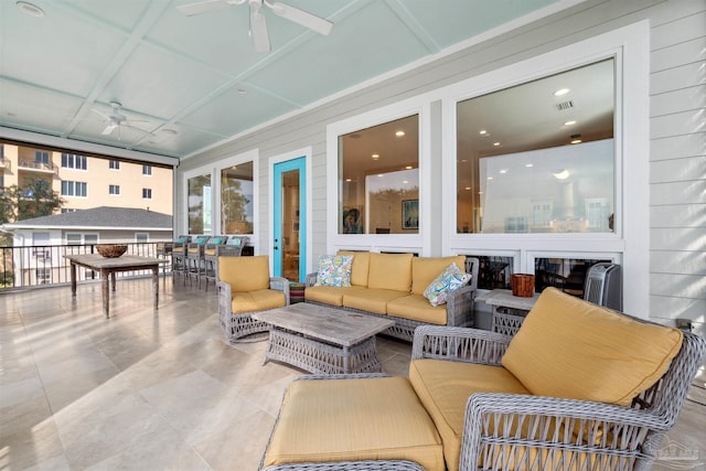 tiled living room featuring ceiling fan