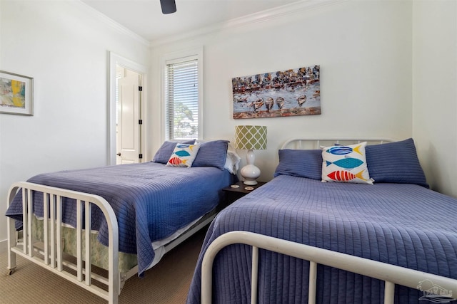 carpeted bedroom with crown molding and ceiling fan