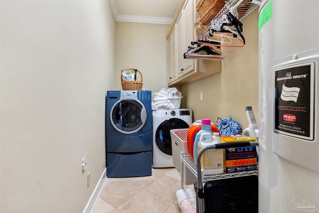 laundry area with cabinets, crown molding, independent washer and dryer, and light tile patterned flooring