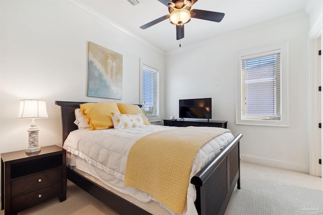 carpeted bedroom featuring ceiling fan, ornamental molding, and multiple windows