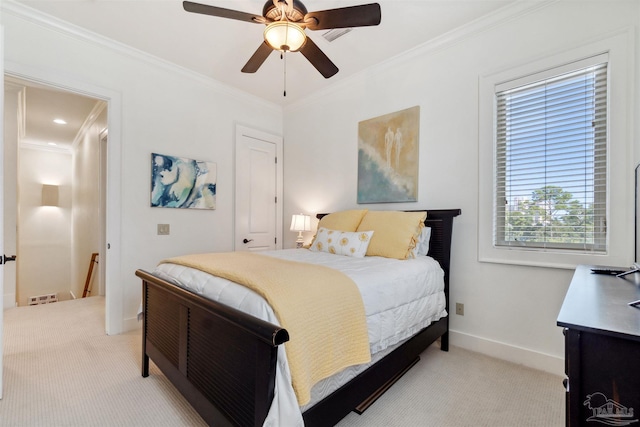 bedroom with ceiling fan, light colored carpet, and crown molding