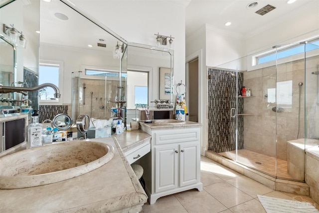 bathroom featuring vanity, plenty of natural light, and an enclosed shower