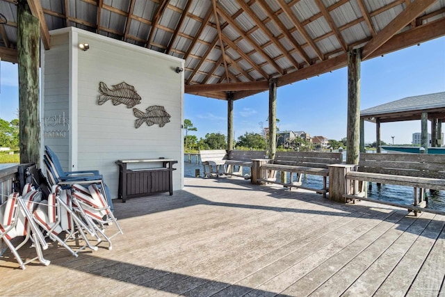 wooden terrace featuring a gazebo and a water view