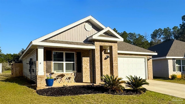 view of front of home featuring covered porch, concrete driveway, board and batten siding, a garage, and a front lawn