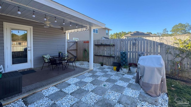 view of patio / terrace featuring a grill, ceiling fan, and a fenced backyard