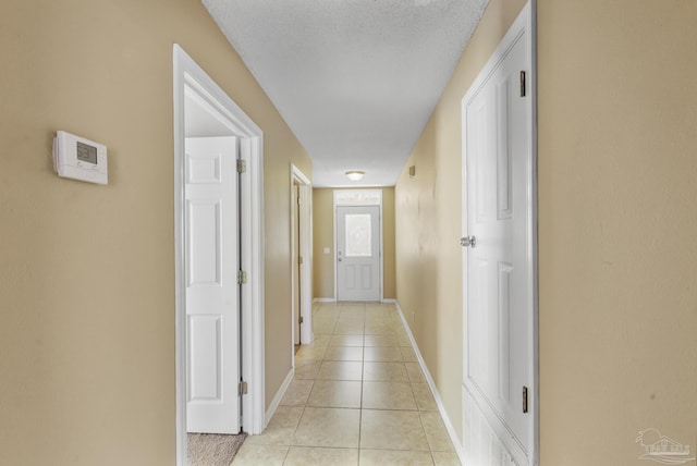 hallway with light tile patterned floors