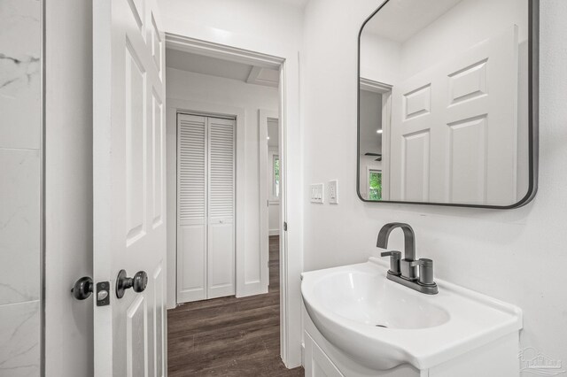 4732 Pine Ln, Pace, FL 32571 - bathroom with wood finished floors and vanity