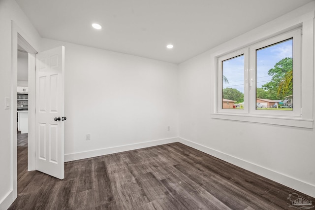 4732 Pine Ln, Pace, FL 32571 - empty room featuring dark wood finished floors and recessed lighting