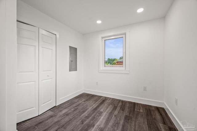 4732 Pine Ln, Pace, FL 32571 - unfurnished bedroom with electric panel, dark wood-style flooring, a closet, and recessed lighting