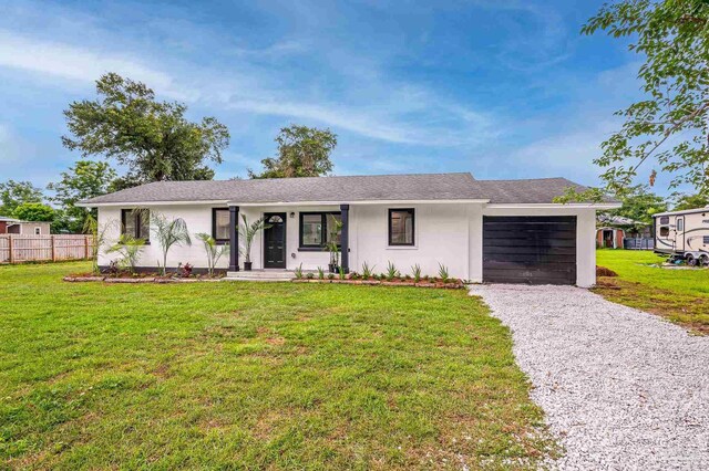 4732 Pine Ln, Pace, FL 32571 - ranch-style home featuring a garage and driveway