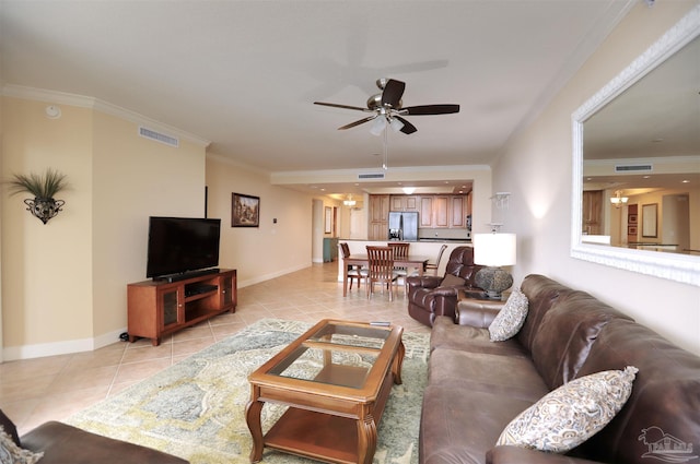 living room featuring ceiling fan, light tile patterned flooring, and ornamental molding