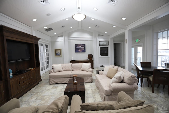 living room featuring french doors and lofted ceiling