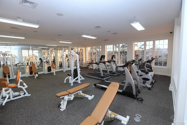 workout area with dark colored carpet