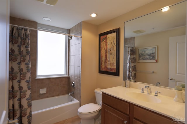 full bathroom featuring tile patterned flooring, shower / tub combo, vanity, and toilet