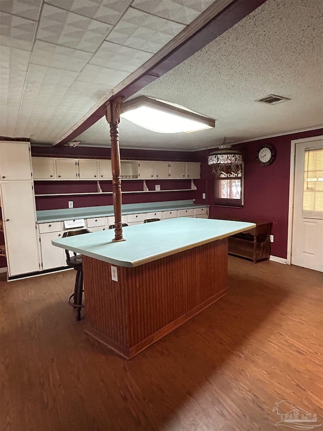 6232 Jalyn Rd, Pensacola, FL 32503 - interior space featuring dark wood-type flooring, visible vents, and a textured ceiling