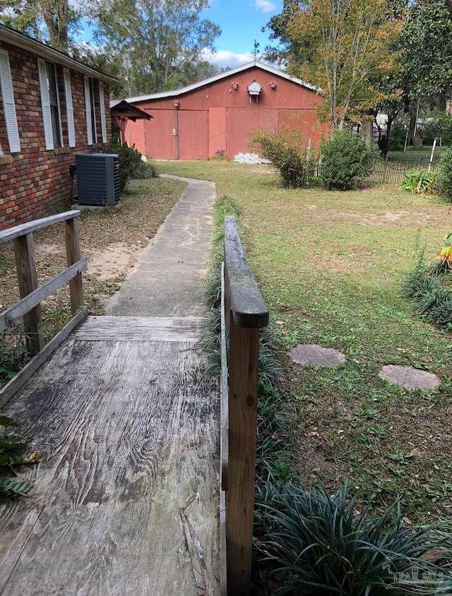 6232 Jalyn Rd, Pensacola, FL 32503 - view of yard with central AC unit, an outdoor structure, and fence