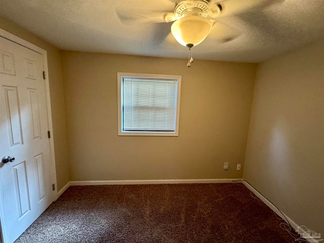 unfurnished bedroom featuring carpet flooring, a textured ceiling, and ceiling fan