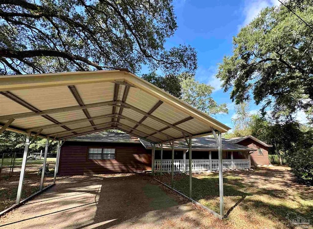 view of parking / parking lot featuring a carport