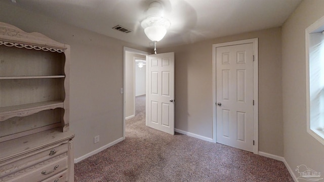 unfurnished bedroom featuring carpet